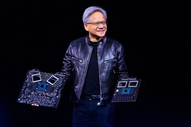 Jensen Huang holding Nvidia chips.