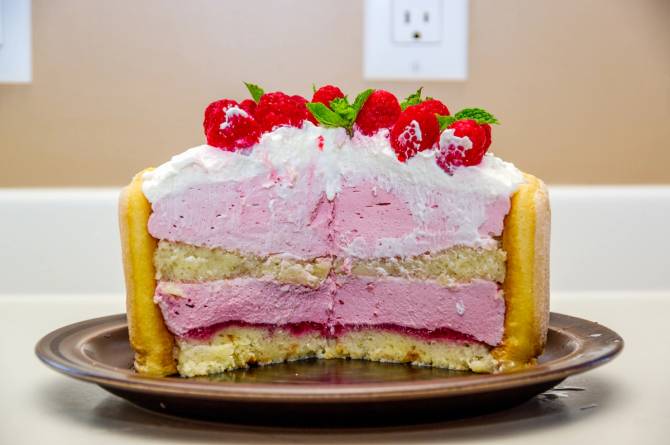 half of a pink and white cake 