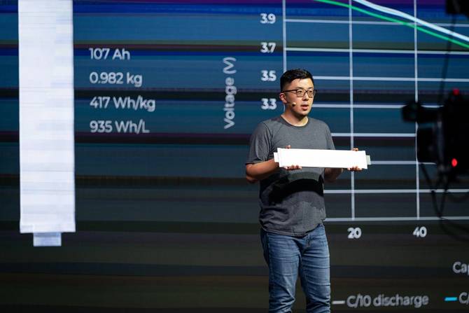 Exec at battery-maker named SES holding a prototype on stage