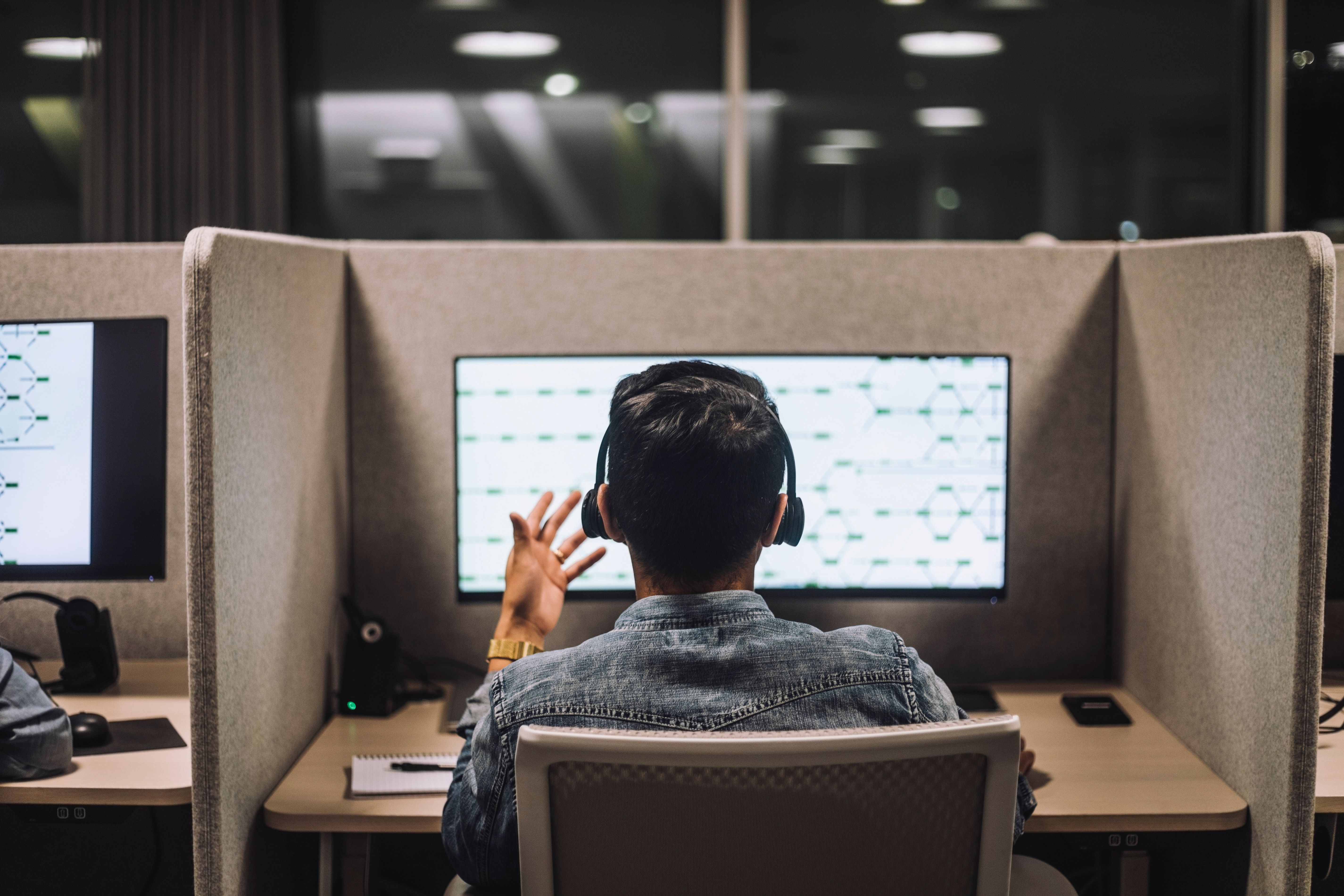 Call center salesperson on phone and computer.
