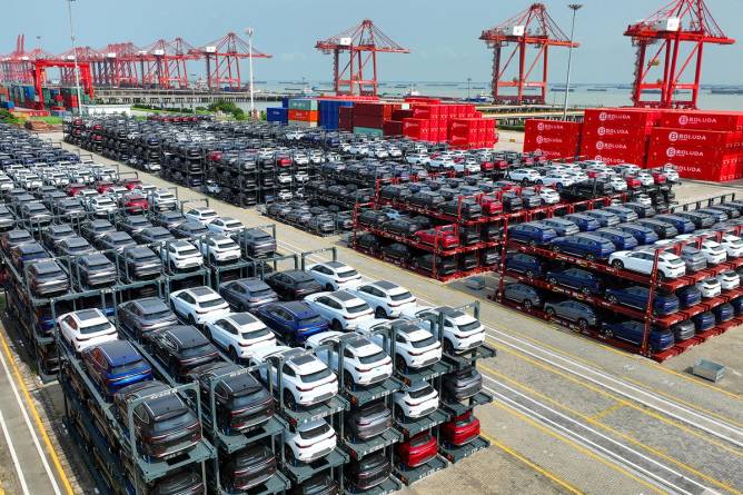 Stacks of cars waiting to be loaded on a cargo ship