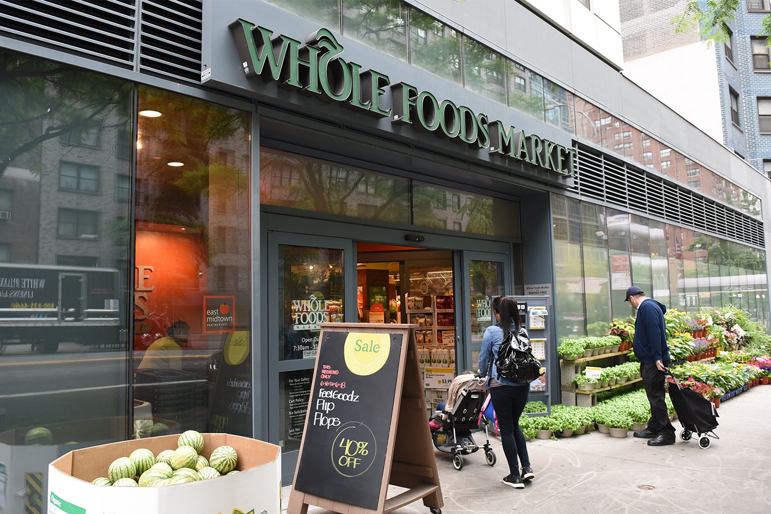 A photo of a Whole Foods Market storefront in Midtown, New York City.