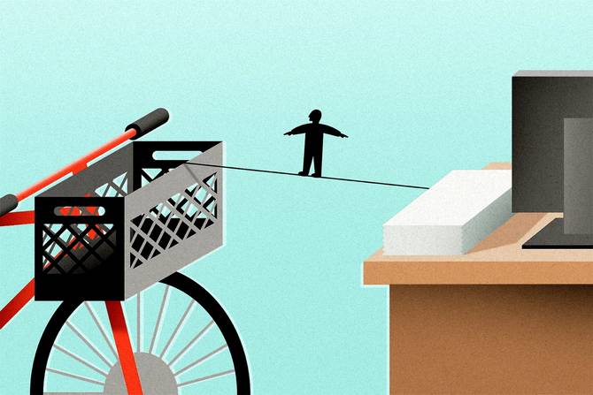 A person walks a tightrope between a desk and bicycle
