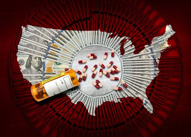 RX pharmacy prescription bottle of pills on a pile of $100 dollar bills and a USA outline
