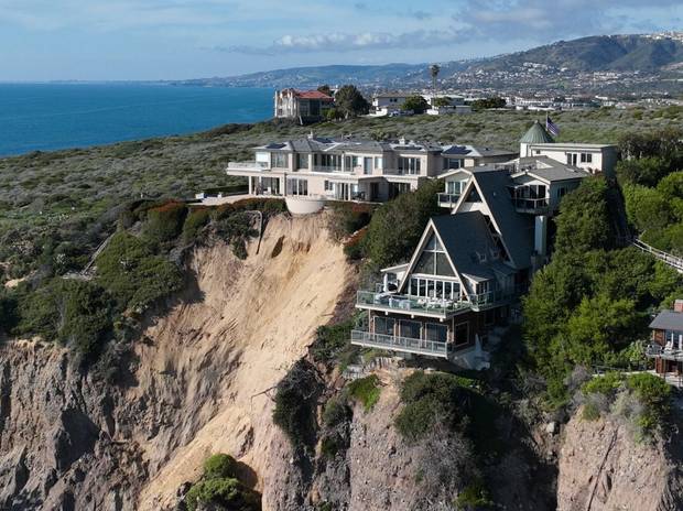 Houses sitting on a cliff in California