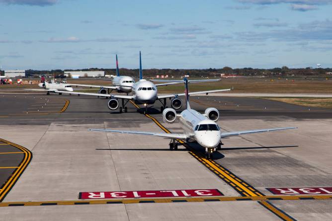Airplanes line up for takeoff