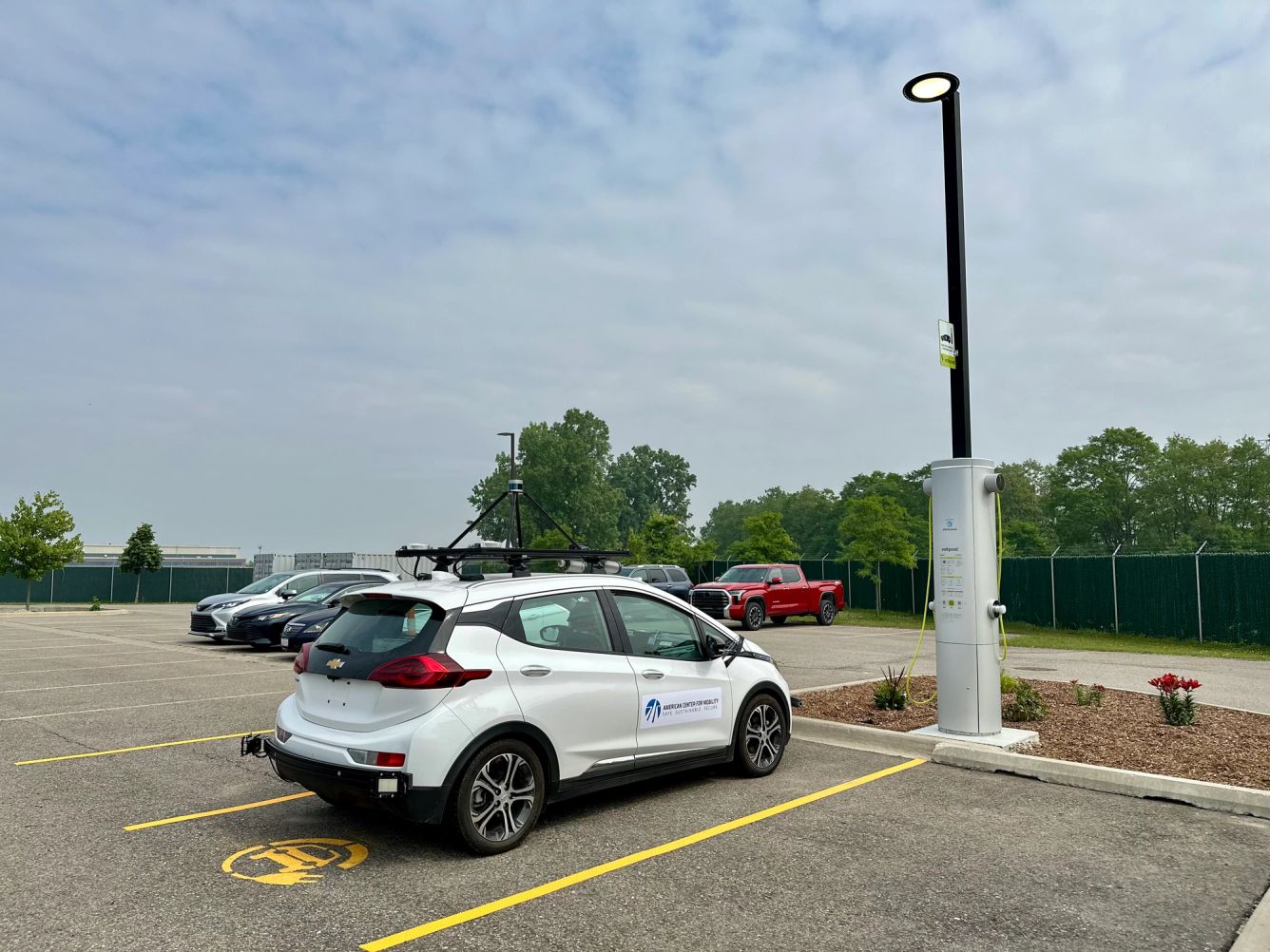 An EV plugged into a Voltpost lamppost charger