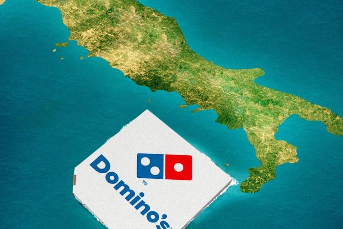 A Dominos box over a map of Italy