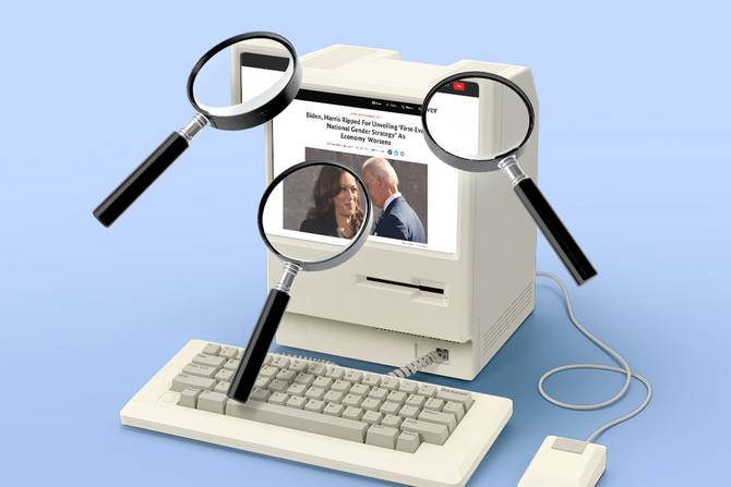 an image of magnifying glasses surrounding a computer with a Daily Wire article on it