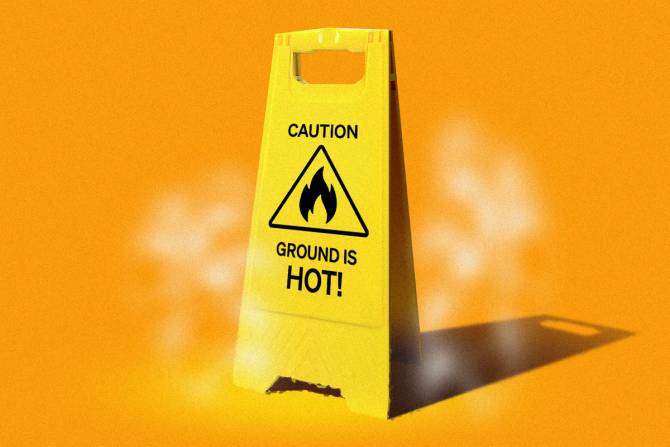 A sign that says caution ground is hot