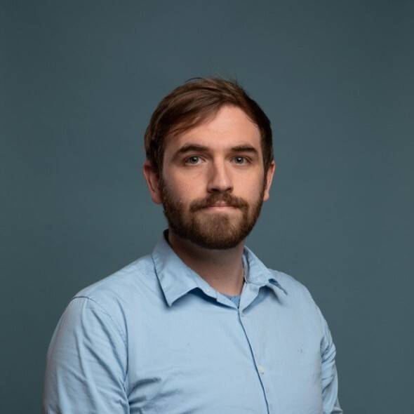 Patrick Kulp headshot in light blue shirt 