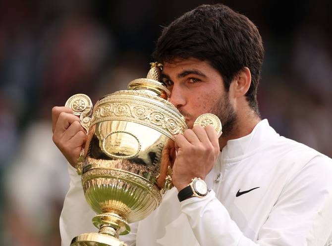 Carlos Alcaraz of Spain with the Men's Singles Trophy following his victory in the Men's Singles Final against Novak Djokovic of Serbia