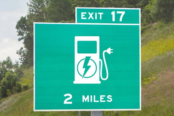 A highway sign referencing electric vehicle charging.