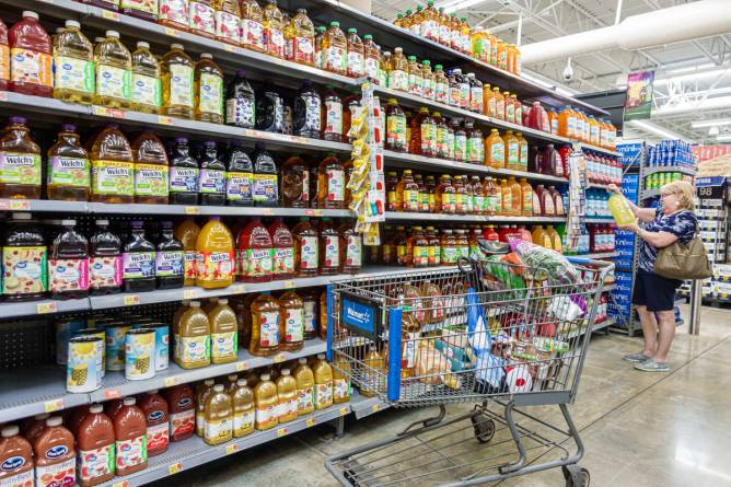 Grocery shopper with cart in Walmart