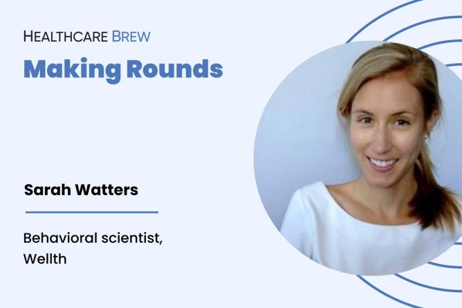 A blonde woman smiles