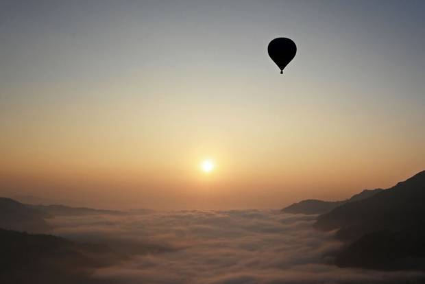 A hot-air balloon rises during the international hot-air balloon festival in Nepal on January 1.