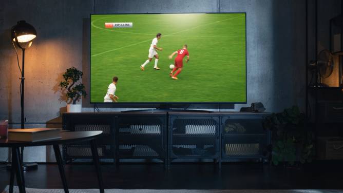 soccer game on TV in an apartment