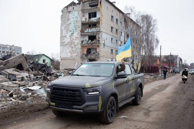 A Ukrainian military vehicle drives through the street on April 5, 2022 in Borodianka, Ukraine