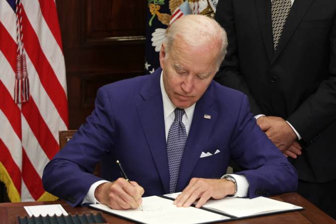 Biden signing an executive order