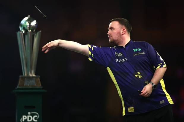 Luke Littler of England throws during the Final against Michael van Gerwen of The Netherlands during day sixteen of the 2024/25 Paddy Power World Darts Championship