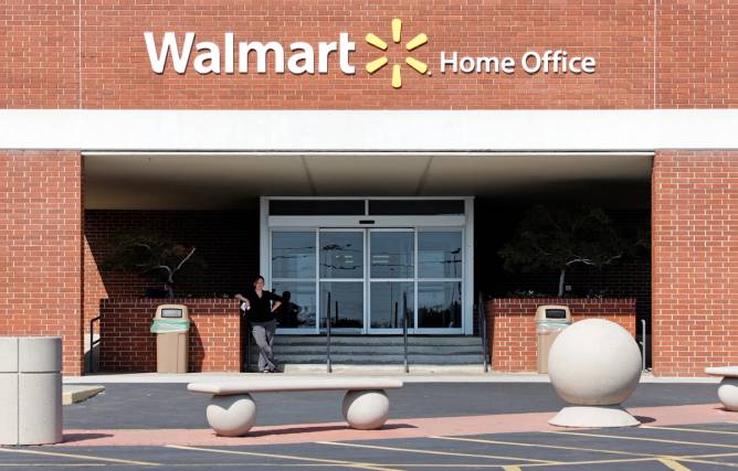 A person standing in front of a Walmart Home Office building