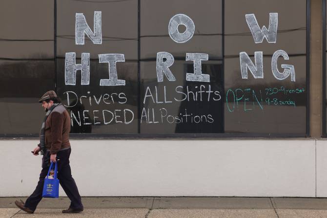 A "Now hiring" sign in New York