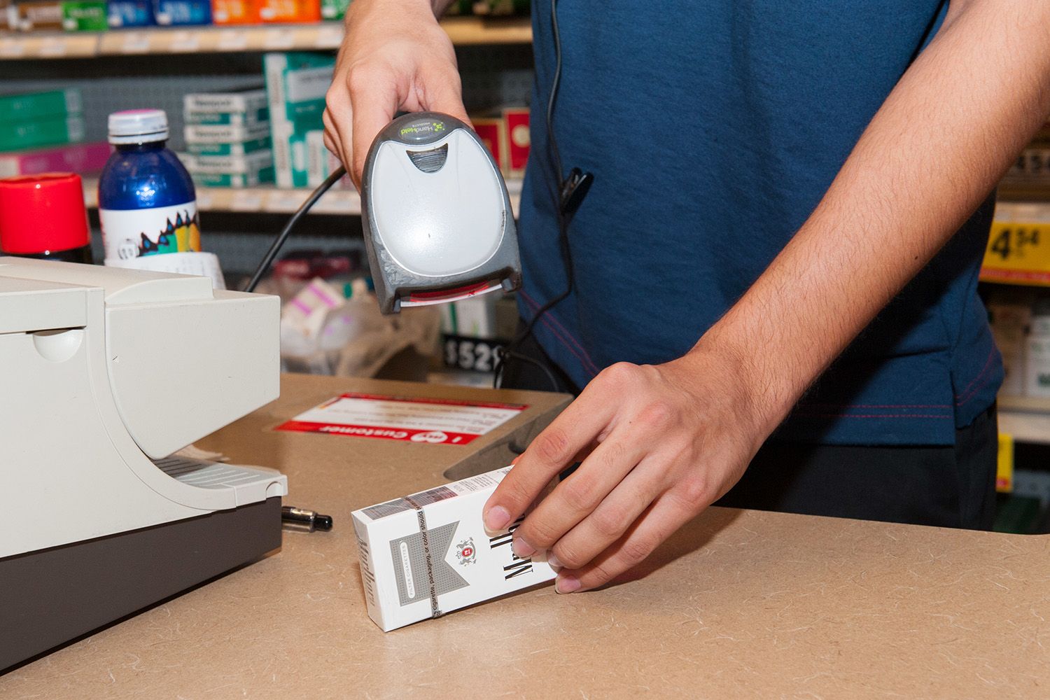 Fully stocked retail shelf, packaged bottles of Johnson & Johnson baby powder.