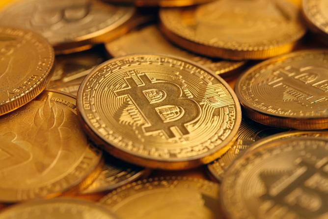 A pile of golden bitcoins