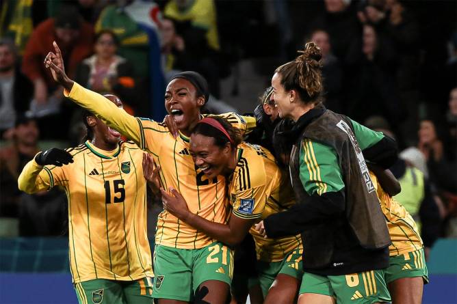 Jamaica's women's team celebrating at the end of a game