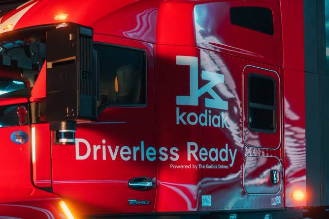 Image of a red Kodiak semi-truck with "driverless ready" depicted on the side.