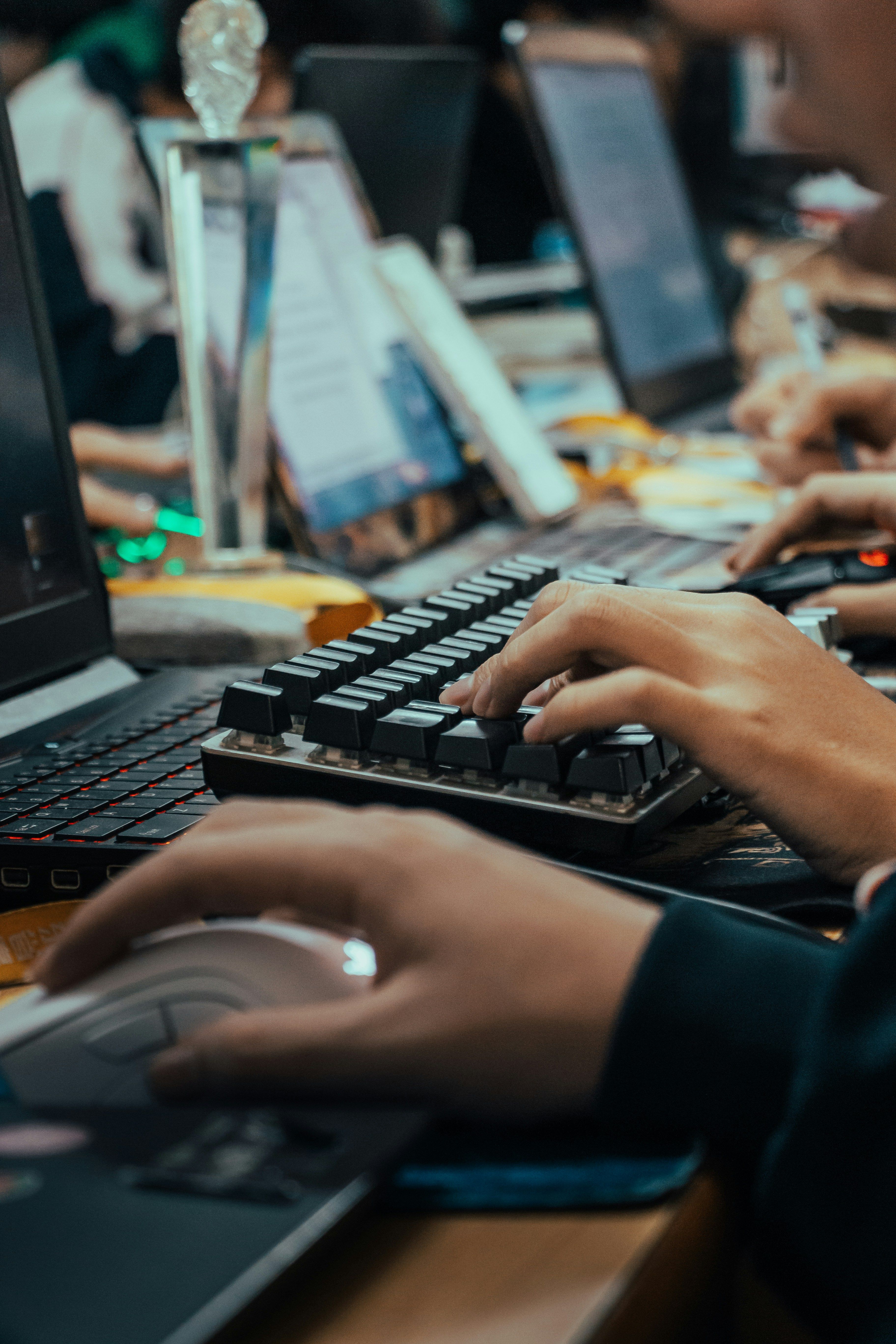 Workers using keyboards, computers.