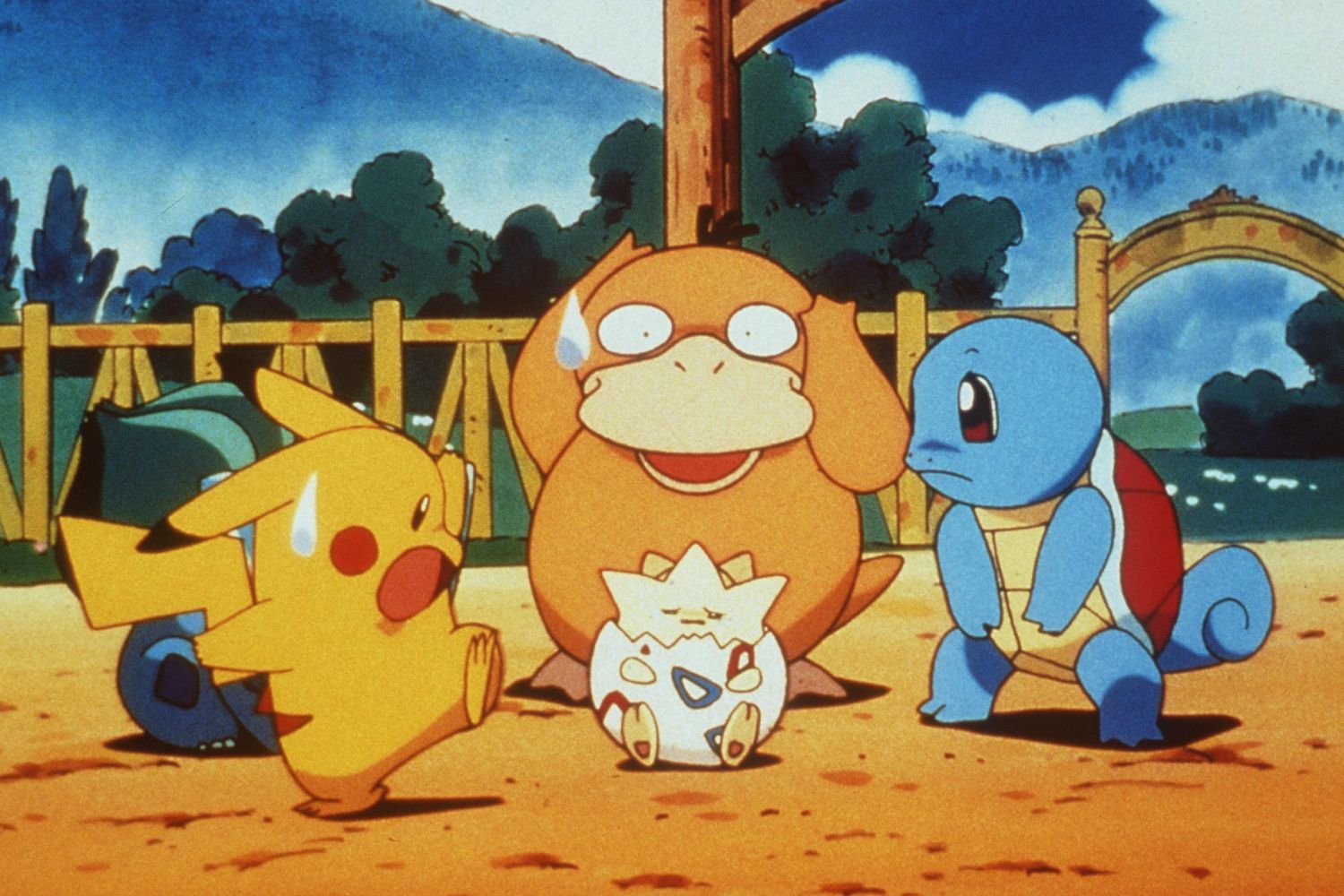 A screen grab from the popular Pokémon television show. Popular characters including Pikachu, Squirtle, Bulbasaur, and Psyduck stand around a smaller Pokémon, Togepi, in a shell.