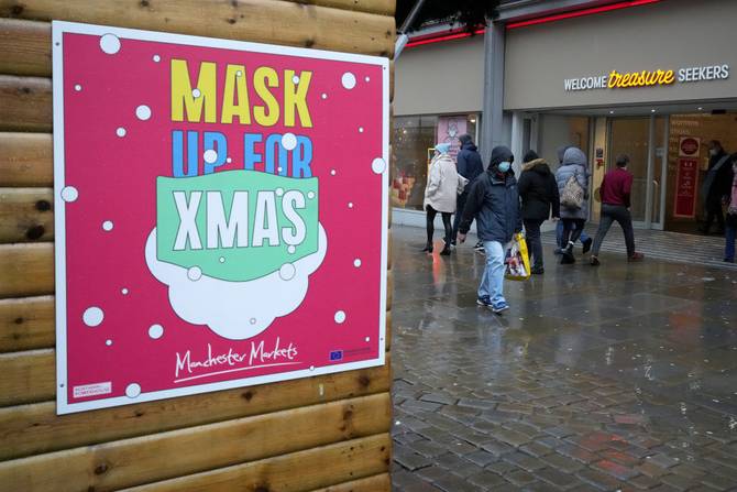 A sign saying "mask up for Xmas" in Britain