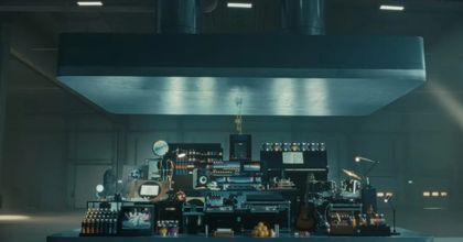 Screenshot of Apple’s new iPad Pro commercial displaying a large crusher looming over a myriad of objects like instruments and art supplies