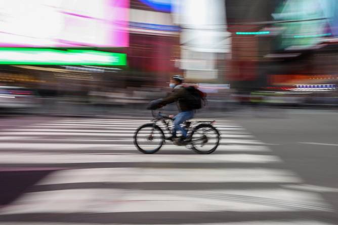 A delivery person on a bike