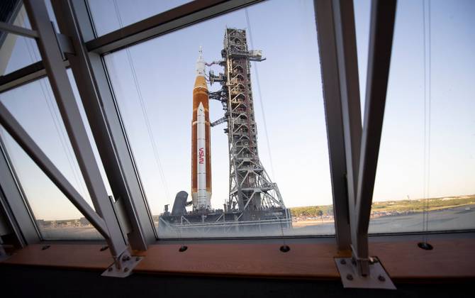 NASA's Space Launch System rocket with the Orion spacecraft aboard is seen atop a mobile launcher in High Bay 3 of the Vehicle Assembly Building.