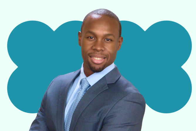 A portrait Didier Bizimungu, Reddit’s head of performance marketing in front of a light green background.