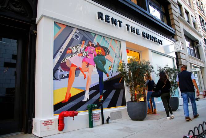 People walk past the Rent the Runway store in New York City.