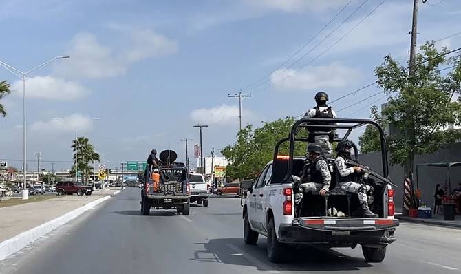 National Guard and military vehicles take part in an operation to transfer two of the four US citizens kidnapped in Mexico's crime-ridden northeast
