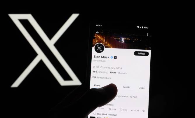 the X logo appears behind a mobile phone with Elon Musk's X profile on the screen