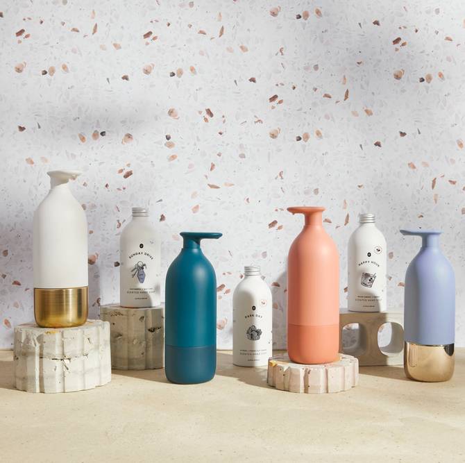 Eddi soap canisters in front of terrazzo background 