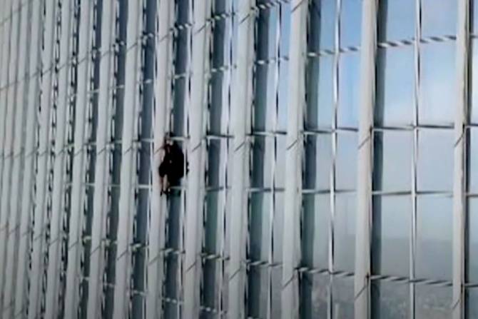 A man climbing on the Lotte World Tower