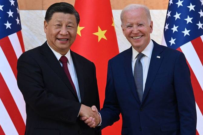 China's President Xi Jinping and US President Joe Biden shake hands