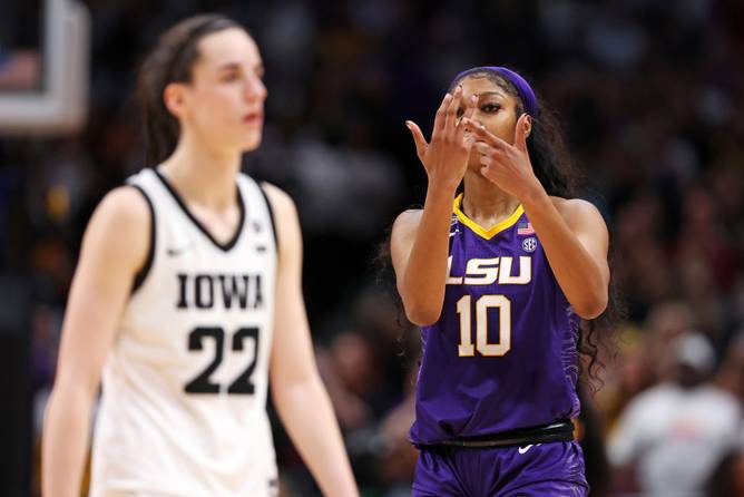 Angel Reese #10 of the LSU Lady Tigers reacts towards Caitlin Clark #22 of the Iowa Hawkeyes during the fourth quarter during the 2023 NCAA Women's Basketball Tournament championship game