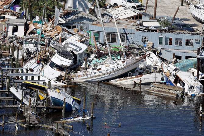 Damage from Hurricane Ian with boats piled on top of each other