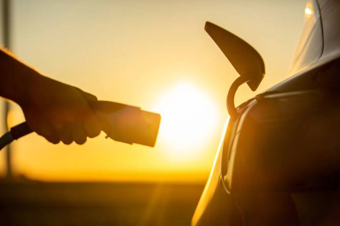 A charger plugging into a car