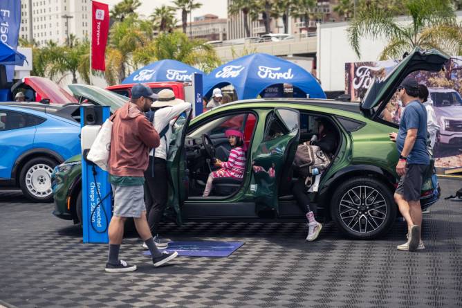 Electrify Expo attendees in Long Beach check out an EV.