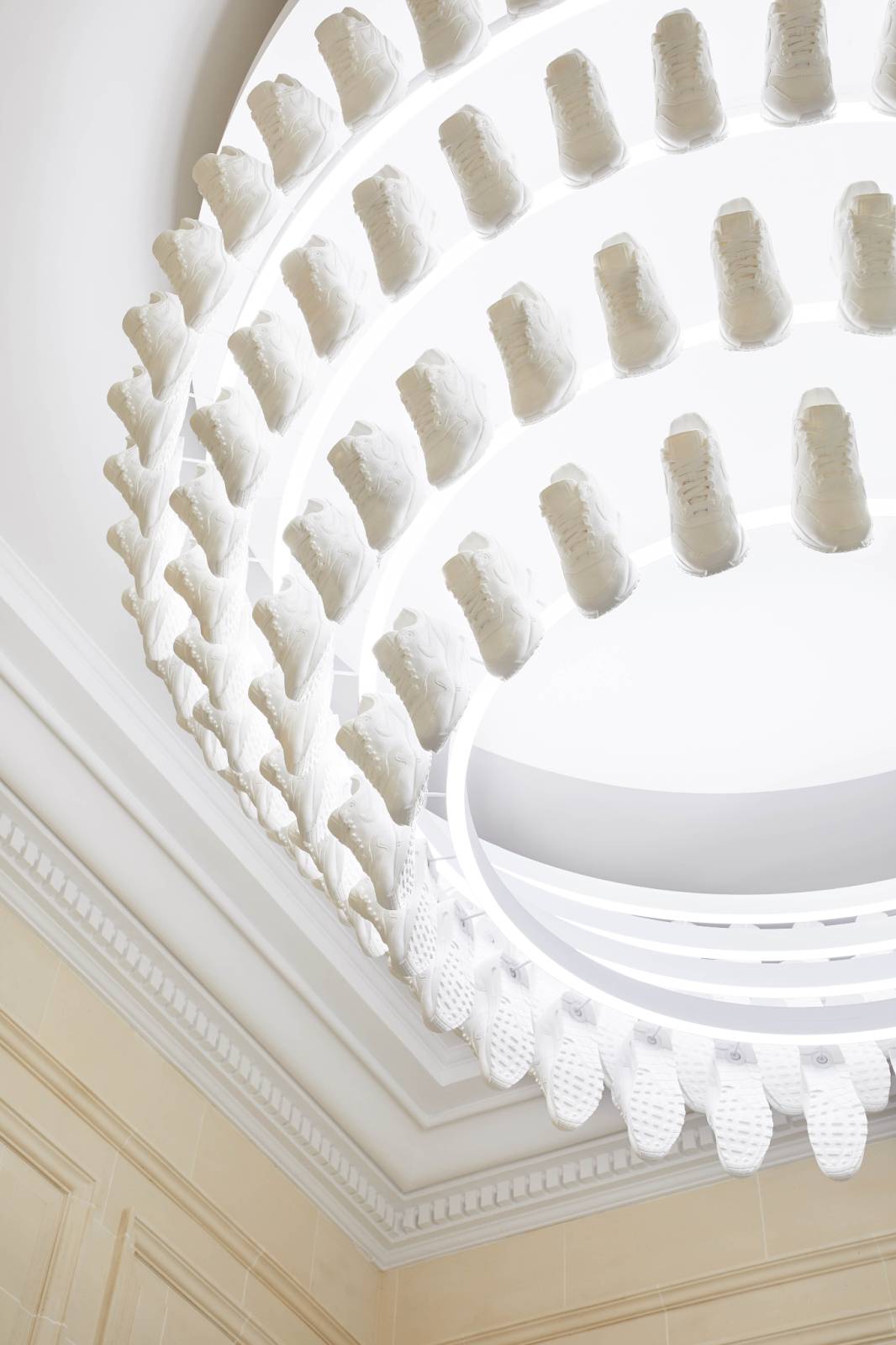 A chandelier made of white sneakers at the Kith flagship store in Paris. 