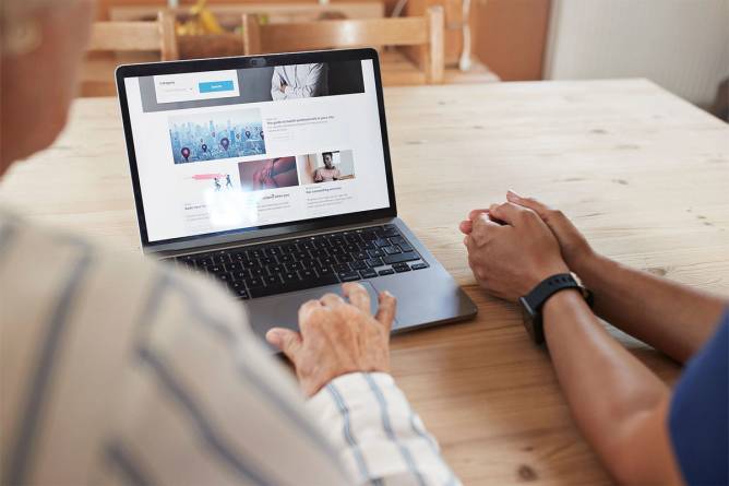 Patients browsing a laptop