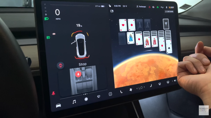 The media center of a Tesla playing a game